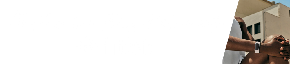 Person wearing a Fitbit device with text 'Find your new fitness partner with Fitbit' on a blurred background
