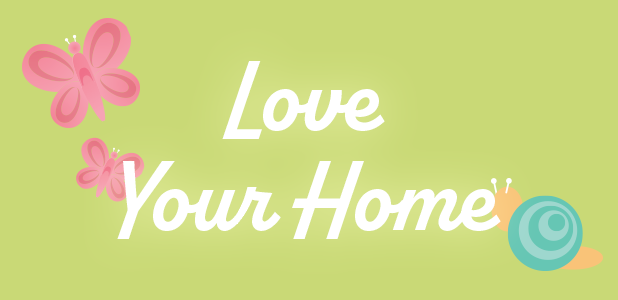 Decorative text 'Love Your Home' with pink butterflies on a green background
