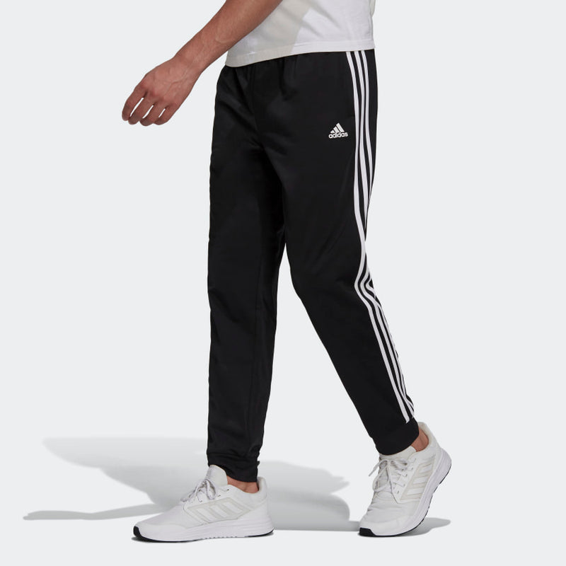 adidas Mens Essentials Warm Up Tapered 3 Stripes Track Pants ShopCGX